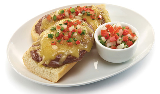 Molletes (Bolillo bread with spreaded beans and cheese)